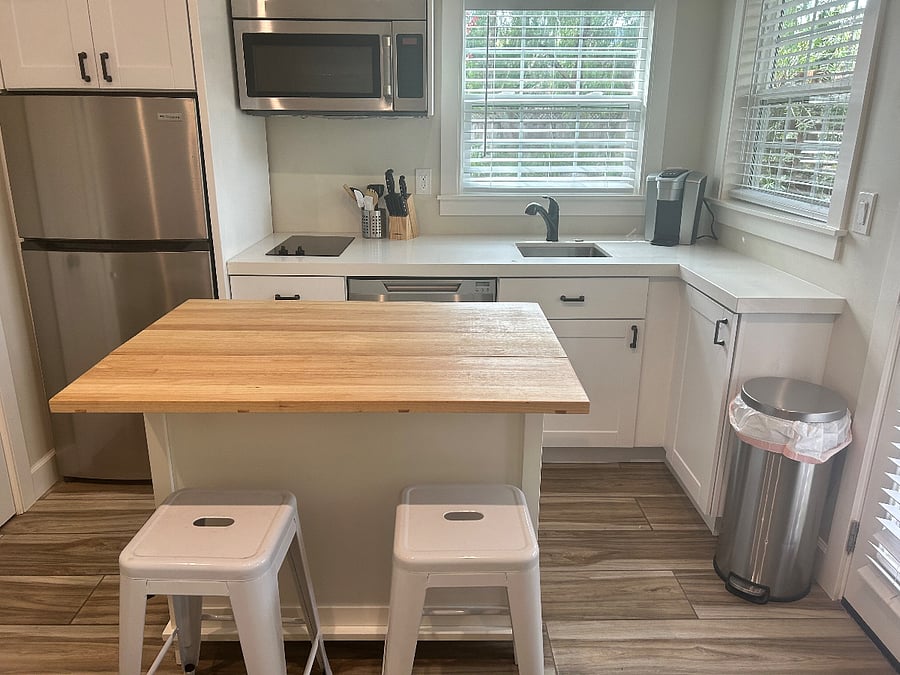 Kitchen with island and two stools