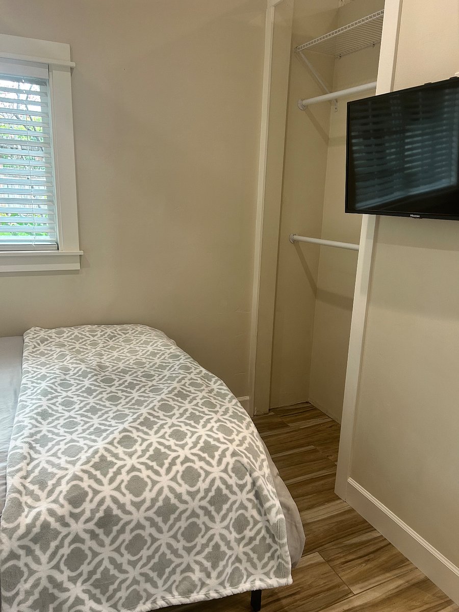 Closet area and bedroom with smart TV