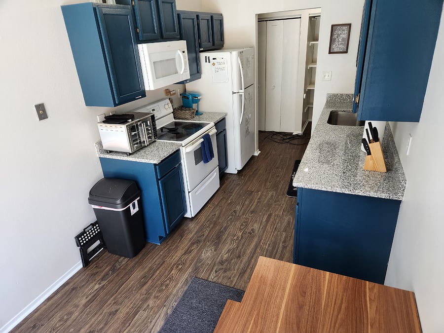 Kitchen with granite countertops & full size appliances. Table that expands & can sit 6. All kitchen needs provided. Airfryer provided. Must provide own consumable.