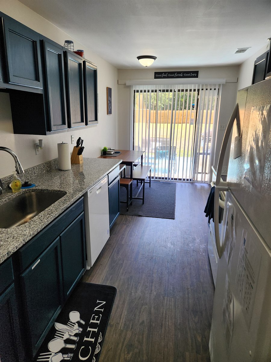 Kitchen with granite countertops & full size appliances. Table that expands & can sit 6. All kitchen needs provided. Airfryer provided. Must provide own consumable.