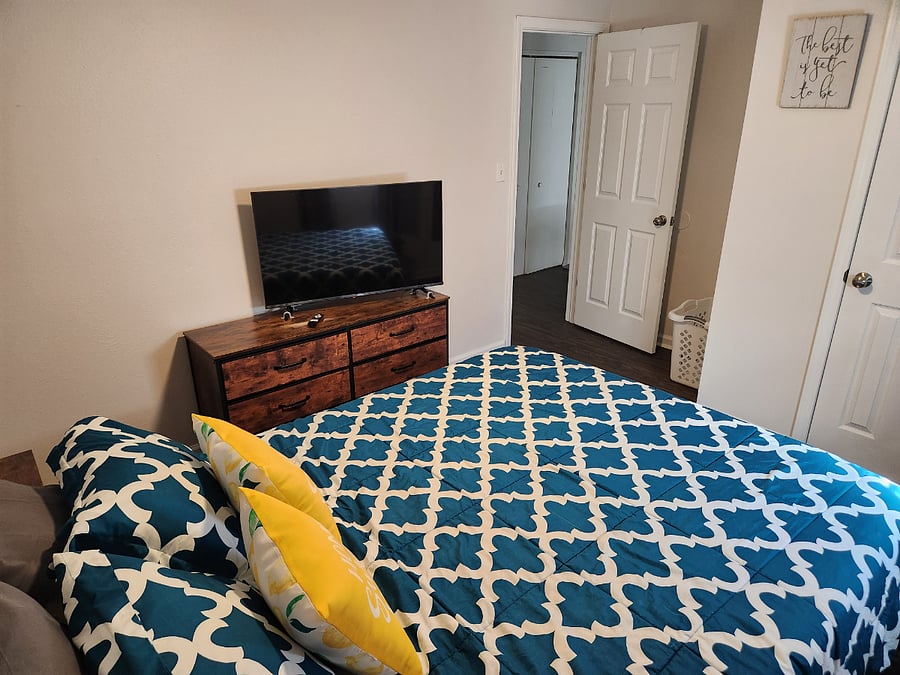 Bedroom2: queen bed, dresser & large closet. 43" smart tv. Spare bedding provided.