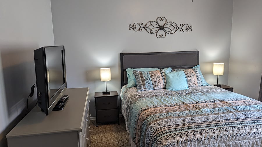 Master Bedroom with TV and Blackout Curtains