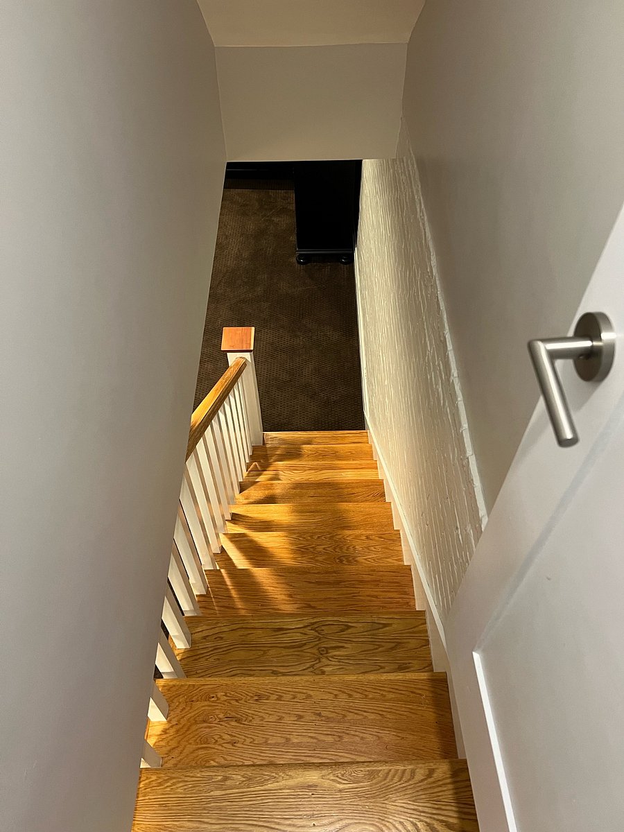 Interior stairs to main level shared chefs kitchen