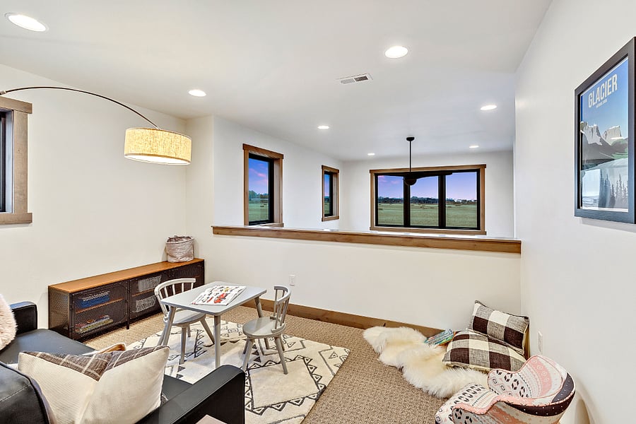 Upstairs common area. A desk has been added to the corner on the right, overlooking the mountain views.