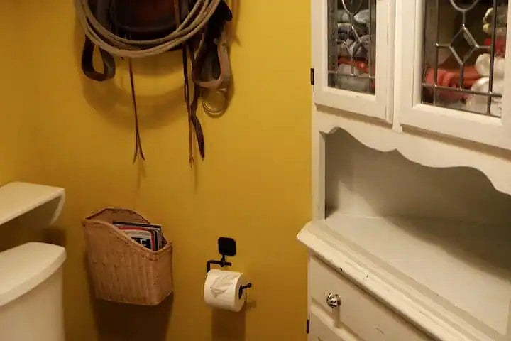 Sunny yellow downstairs bathroom w/ cupboard for bathrobe, slippers, linens & toiletries for guest use only. Horse boarders may occasionally use sink or toilet.
"The bathroom is clean, even though it's in a barn."
