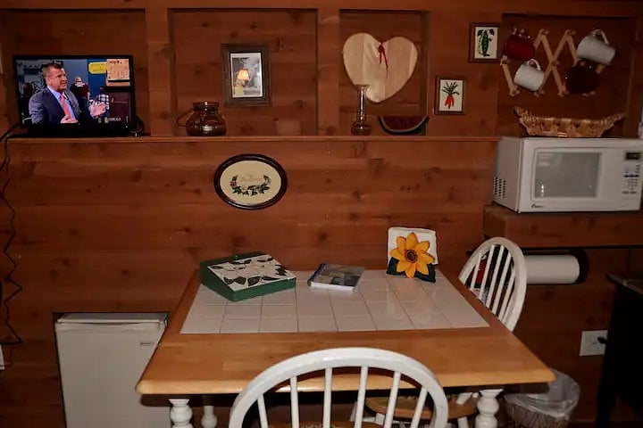 TV, office supplies, Double drop leaf dining table, 2 chairs, refrigerator, microwave oven
