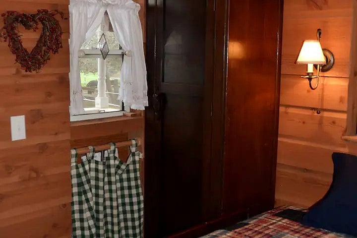 To right of Dutch door: Armoire with hangers, collapsible hamper, ironing surface, drying rack, & broom. Utility area behind green/white curtain w/cleaning supplies, iron, & hair dryer.
Please maintain the cleanliness of the room. The cleaning fee is for deep cleaning after your stay, & includes the laundering of the provided linens & towels, to be arranged.