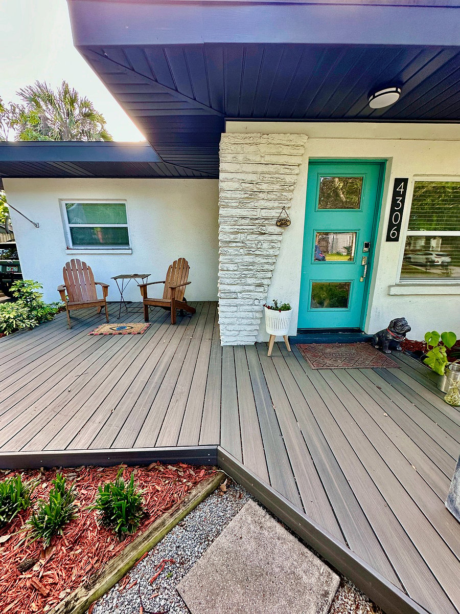 Beautiful composite deck front porch with 2 adirondack chairs