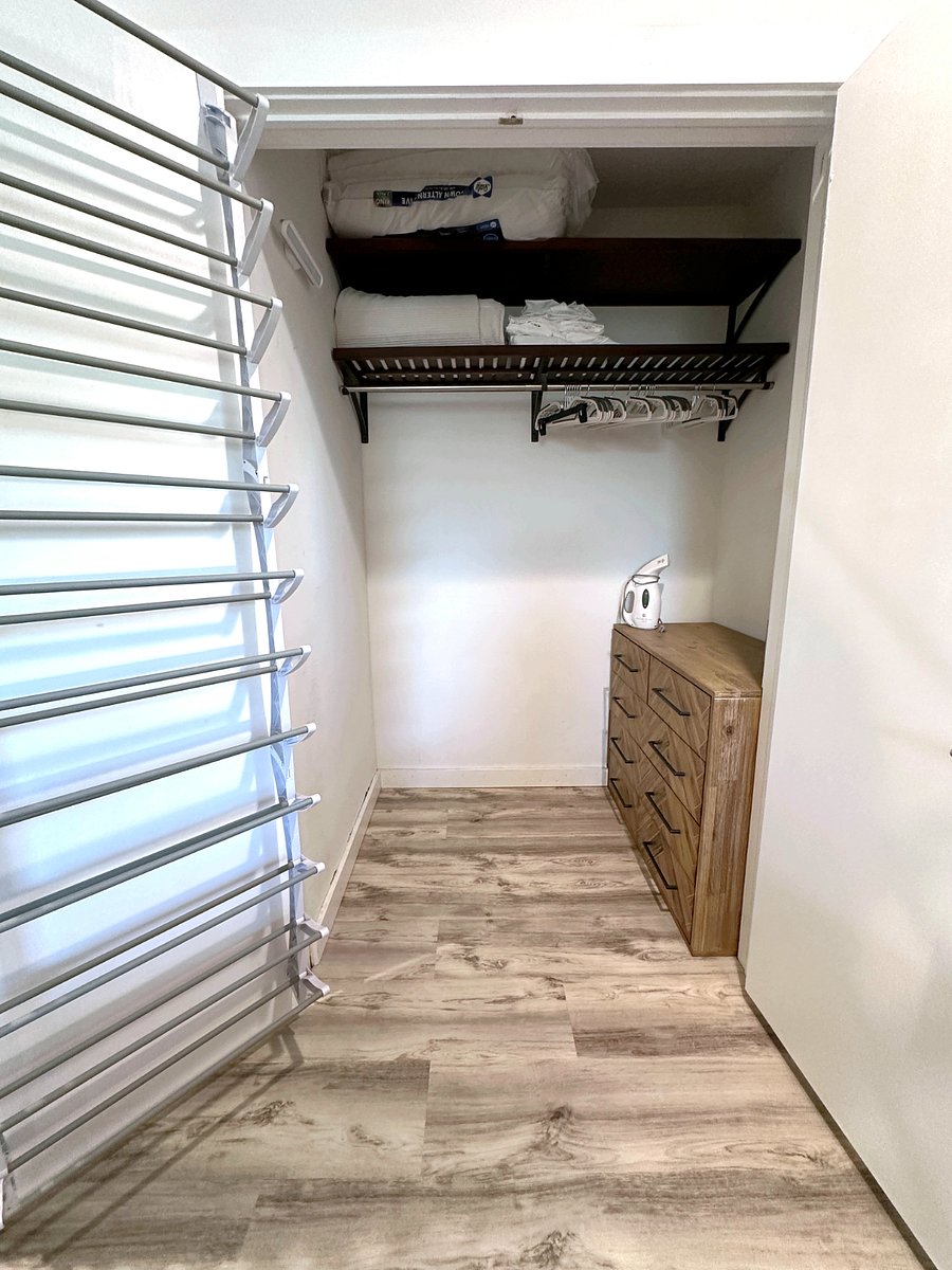 Very spacious walk-in closet with storage