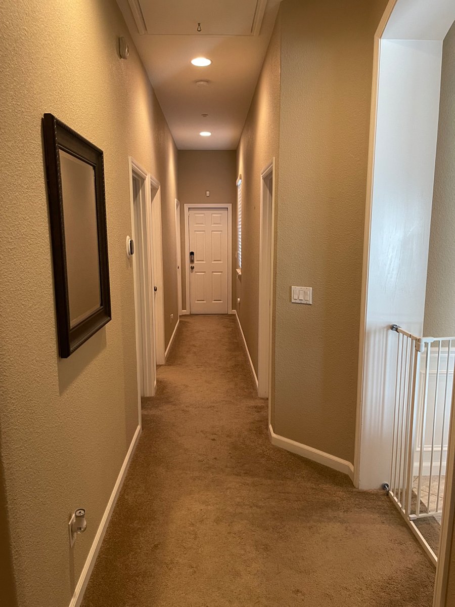 Hallway to private bathroom and bedroom, gate separates bedrooms from the rest of the house so rooms remain free of hair and dog dander.