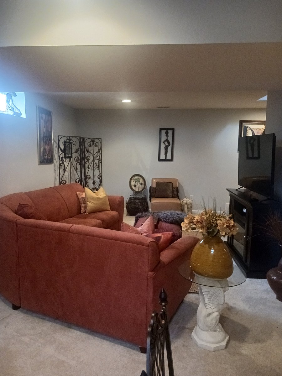 Living room - sectional sofa, end tables, chair, fireplace, 50 inch television.