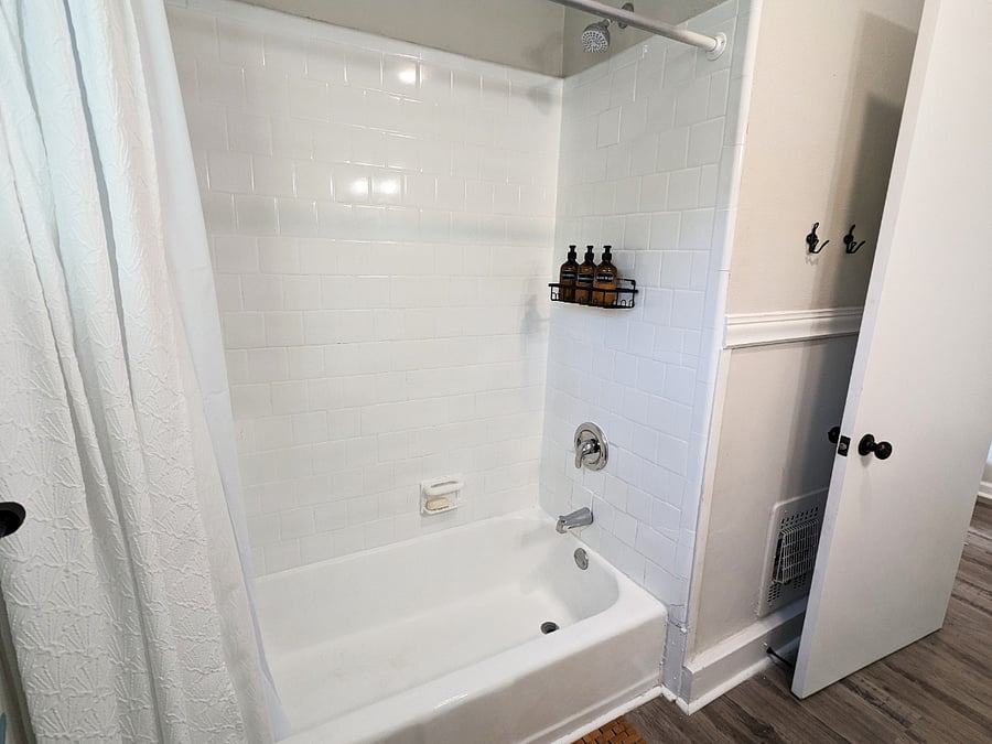 The clean and bright bathroom will help wash your cares away.