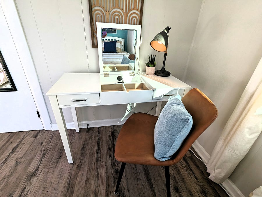 This desk, located behind a closed door if you choose, opens up to a vanity mirror to get ready for the day.