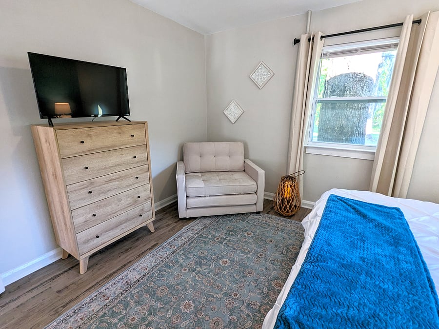The chair is a great place to read or becomes a bed when necessary. The dresser and closet give you room to settle in a while. Stream your favorite shows on the smart TV.