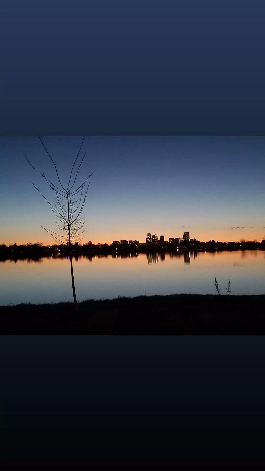 Sloan's Lake at sunrise over Denver. Itis one block from the house. 