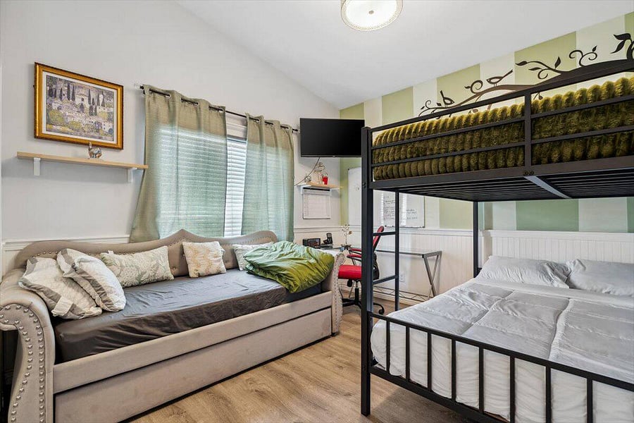 Perfect for families or groups, this cozy room sleeps several and includes a workspace, smart TV, and playful design touches.