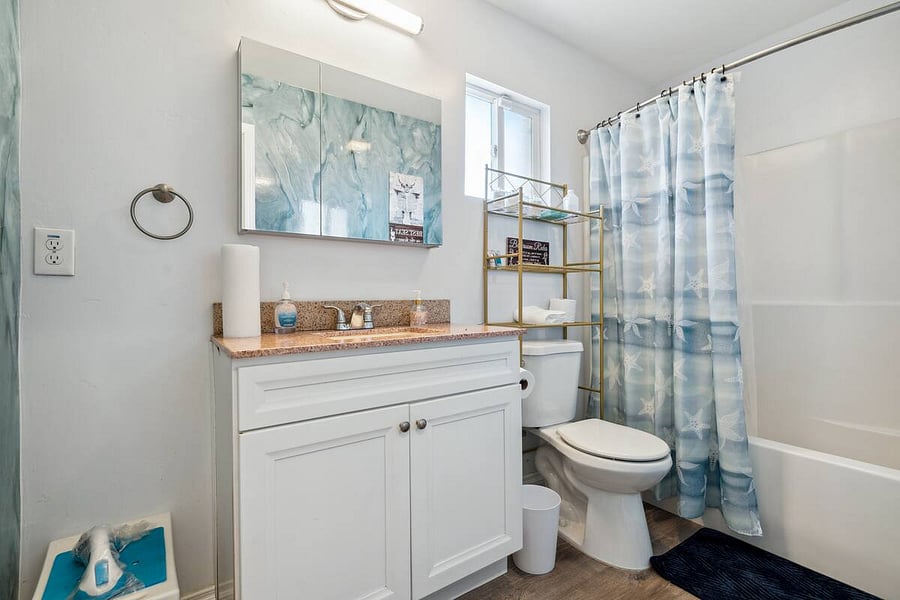 Fresh, functional, and fully stocked, this bathroom offers a calming vibe with ocean-inspired details, plus everything you need for a comfortable stay.