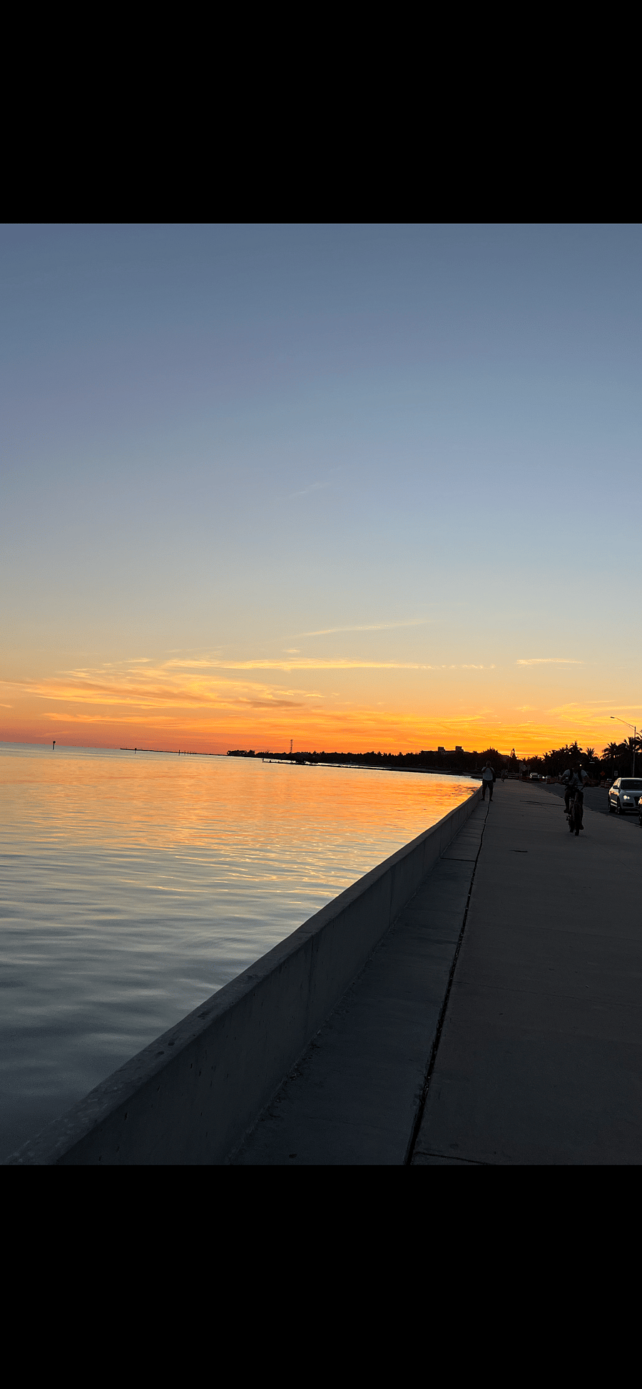 Walking on the promenade across the street