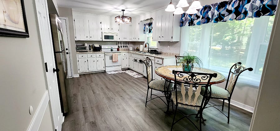 Eat in kitchen with view of the tree lined backyard and the bird feeder through the bay window.. Bird food included.
