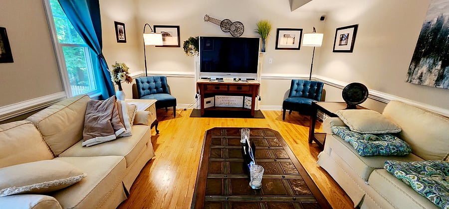 Livingroom with flat-screen television and Firestick. This room is typically shared with me. It tends to be mostly used by the people on the 1st floor.