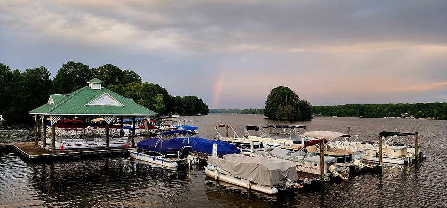 This is the marina. The canoes, and kayaks can be rented at the Woodlake office for a small fee. 
I took a picture of the rainbow over the lake on the day I closed on the home. 