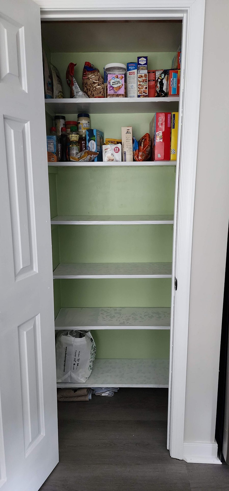 Shared kitchen panty. Each person will have a designated shelf for dry food storage. Currently the configuration is such the short person has the lower shelf. 