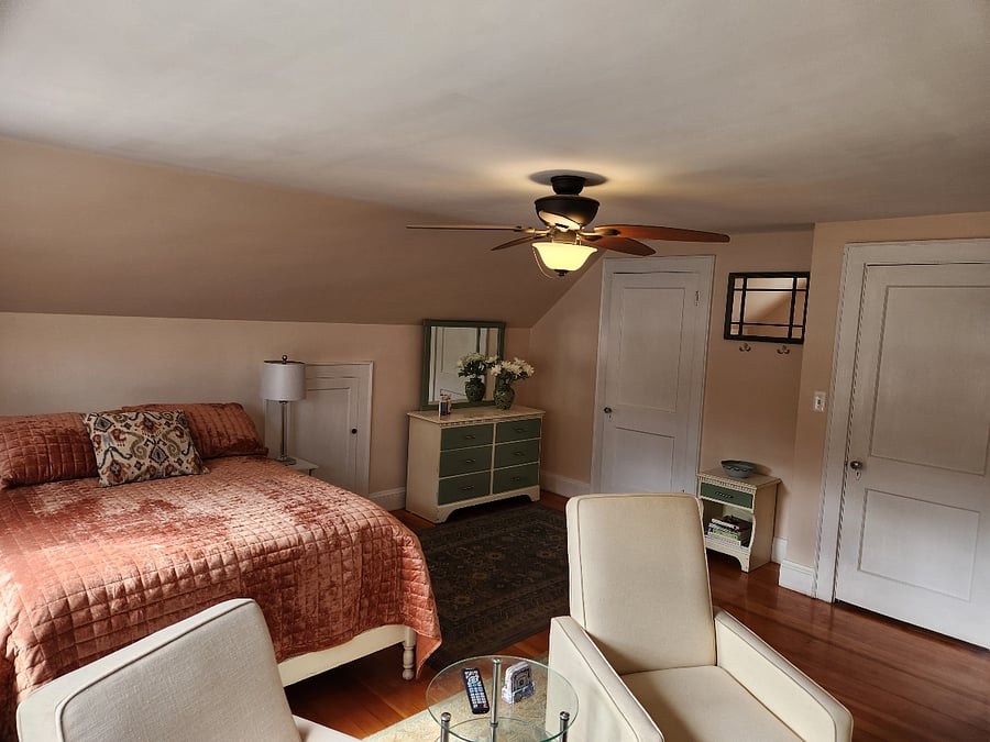 View of entrance door, mini entry table/area, closet and dresser