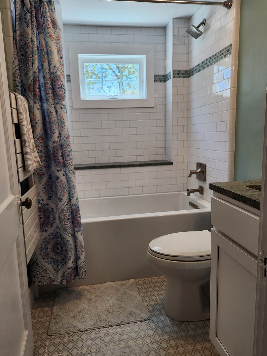 Shared upstairs bath with shower, deep soaking tub and towel warmer