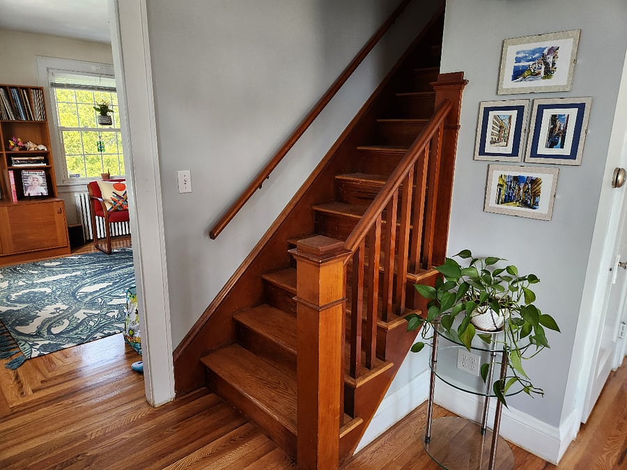 Stairs to the upstairs rental rooms and shared bath