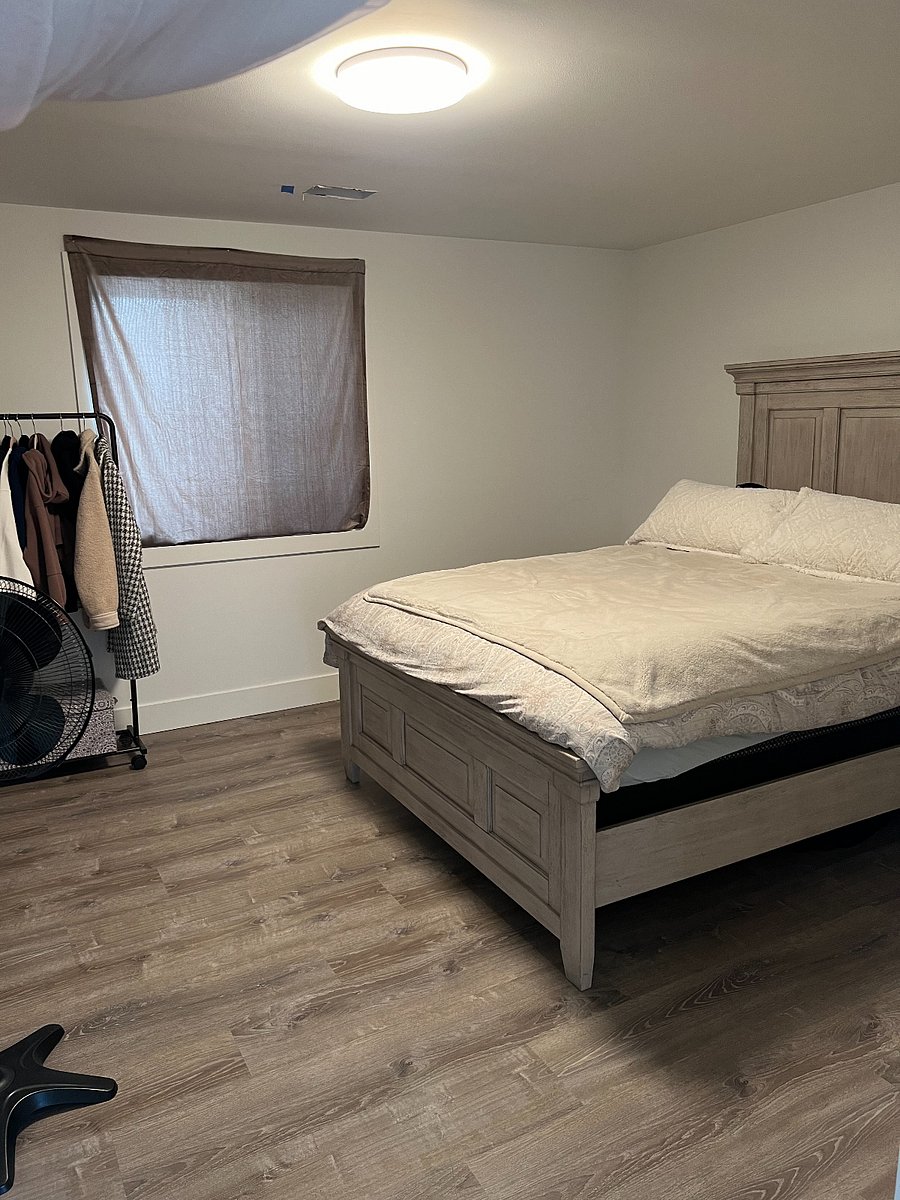 Downstairs bedroom with queen bed and ample closet space. New blinds coming June 2024!