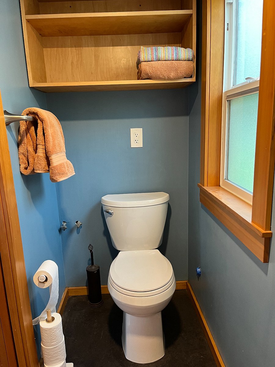 Bathroom: has a sliding pocket door for privacy.