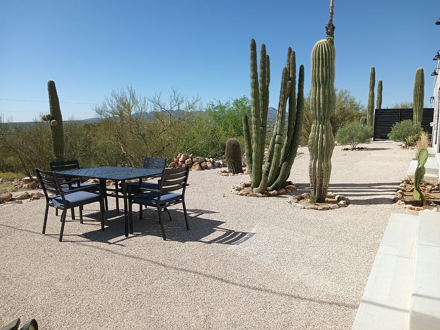 Beautiful just completed patios with decomposed granite. Two patio tables one to watch the sunrise and one to watch the sunset.  Exterior lighting along front of house