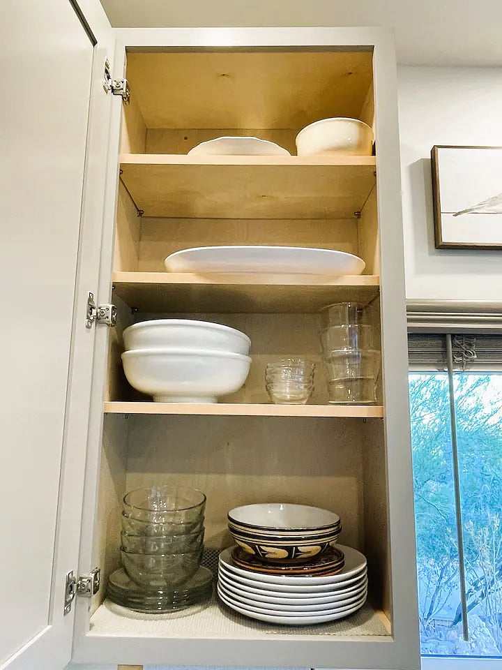 Kitchen has ample supplies for cooking and eating
