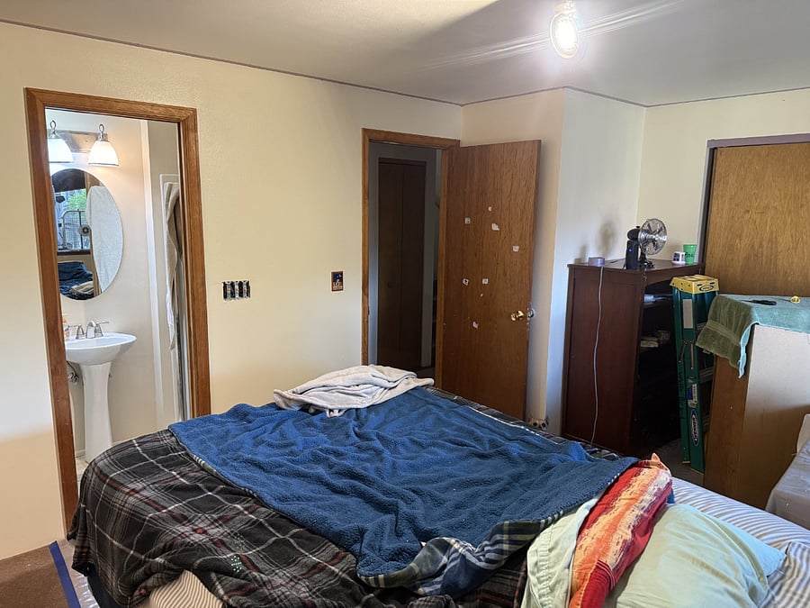 Bedroom. The room is being repainted at time of this photo.