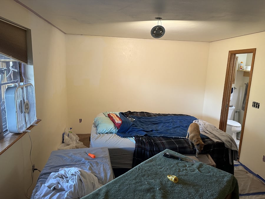 Bedroom. The room is being repainted at time of this photo.