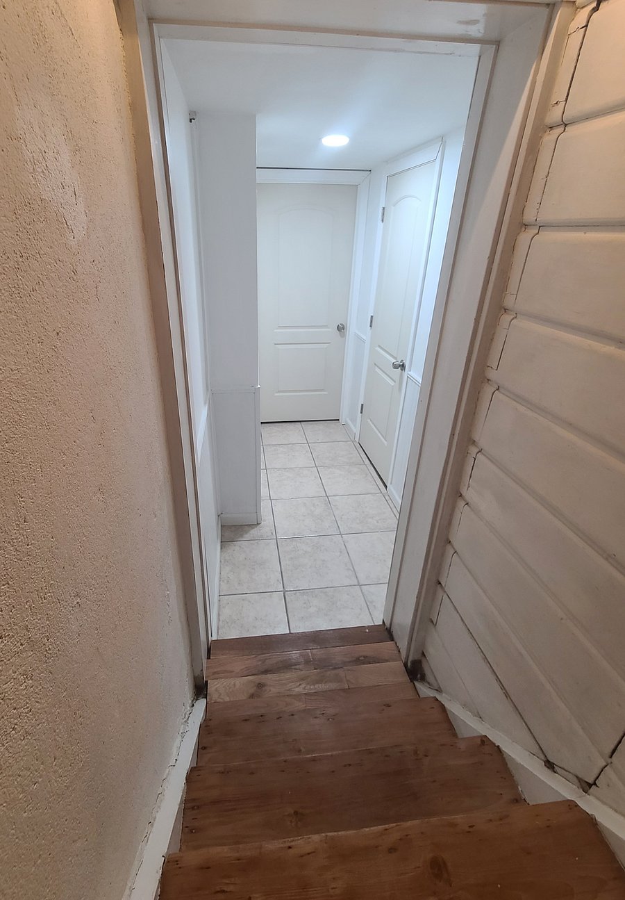 Stairs and hallway to the private master suite