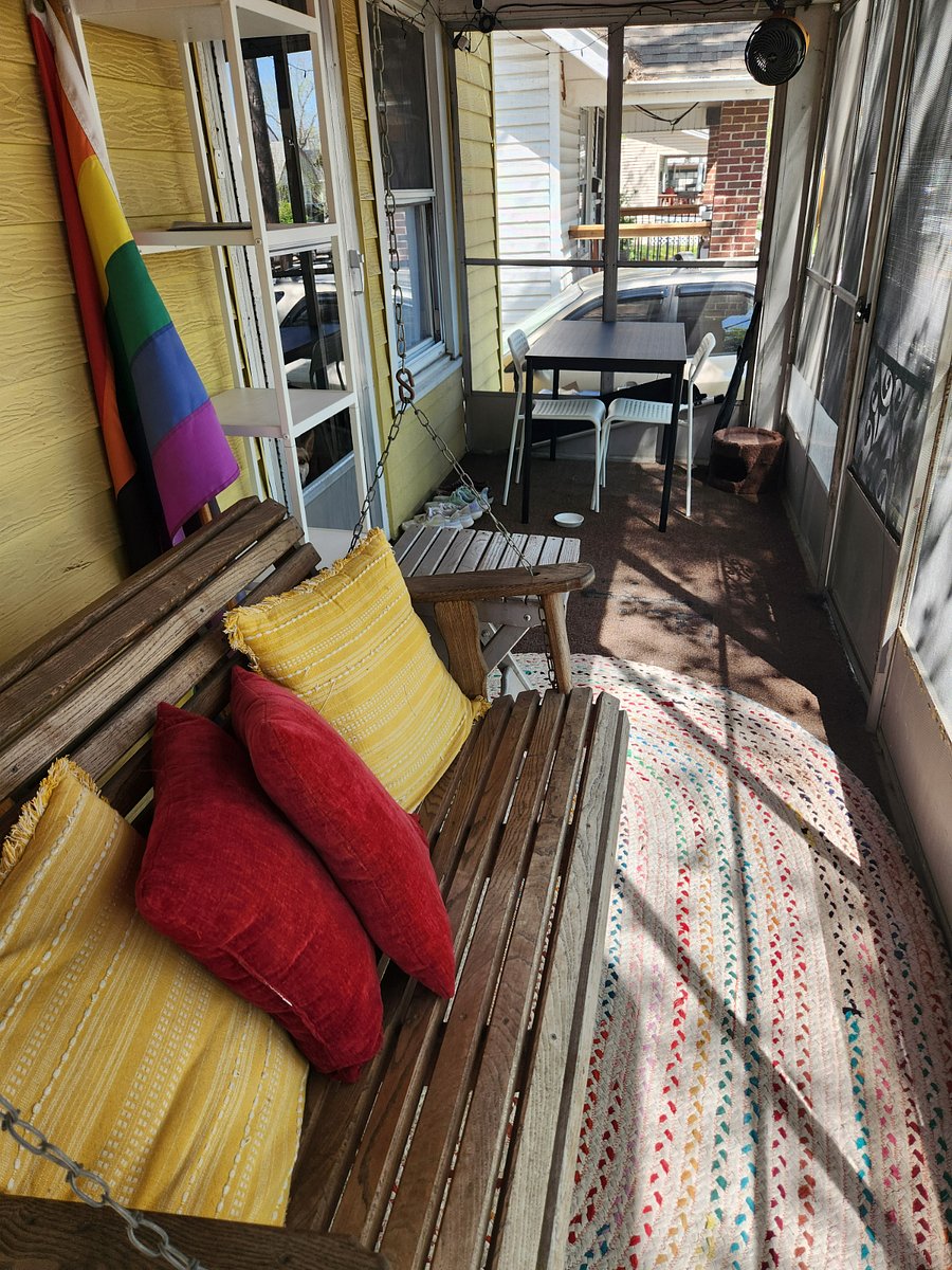 Front porch with table and swing
