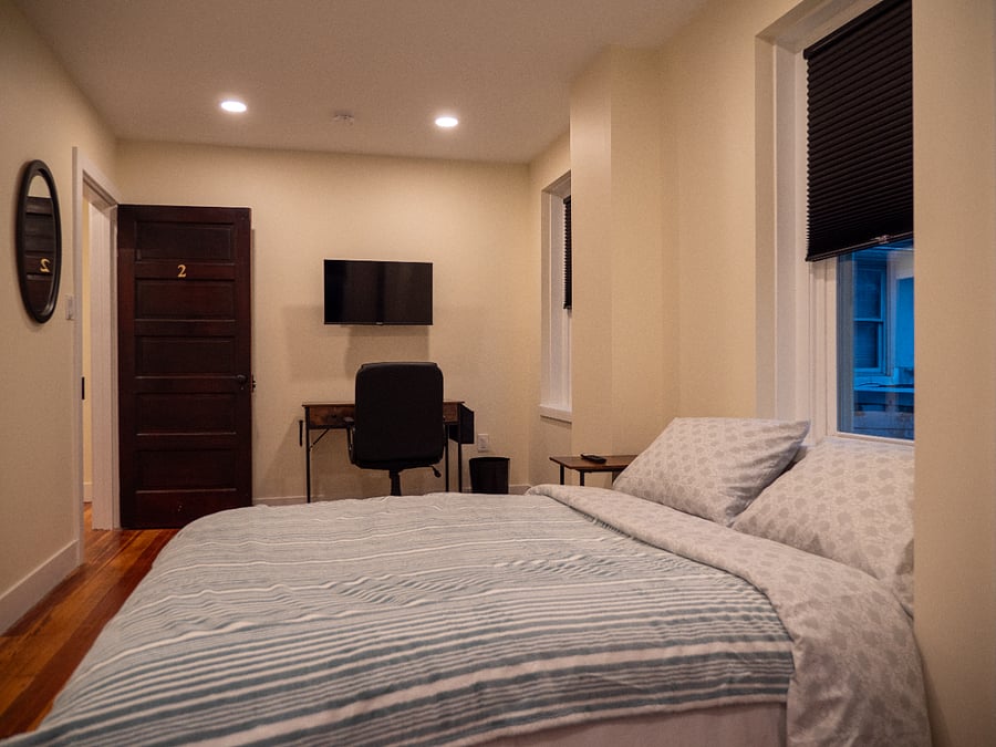 Room #2. Queen bed, work station, Smart TV, bureau, & closet