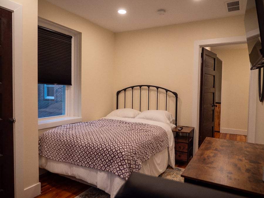 Room #1. Full bed, work station, Smart TV, bureau, & closet