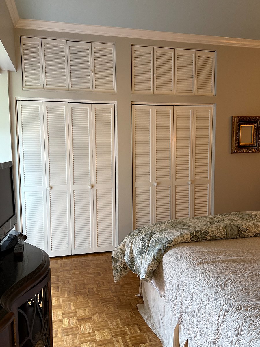 Master Bedroom with ample closet space and TV