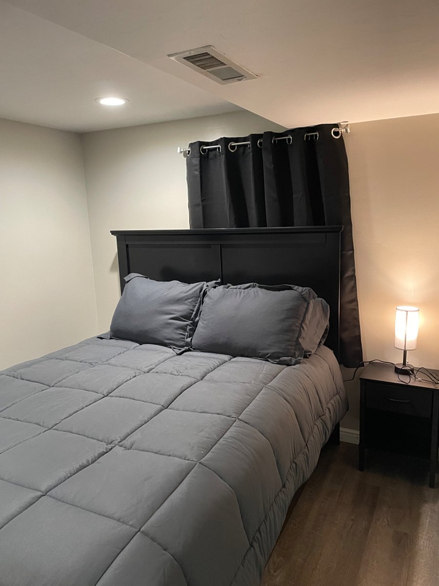 1st bedroom- bed & nightstand 