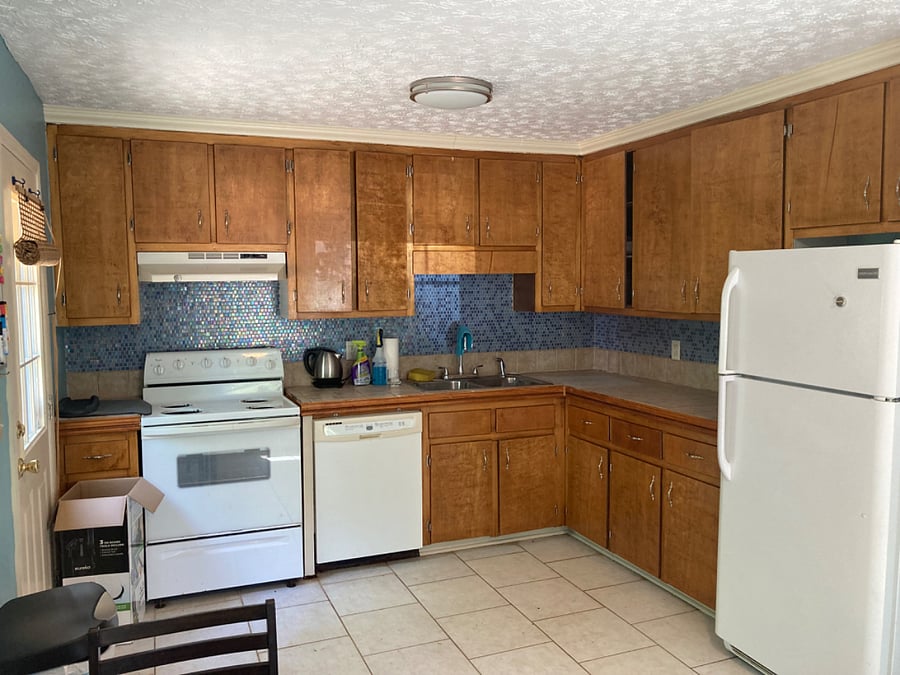 Kitchen stove, cabinets, refrigerator