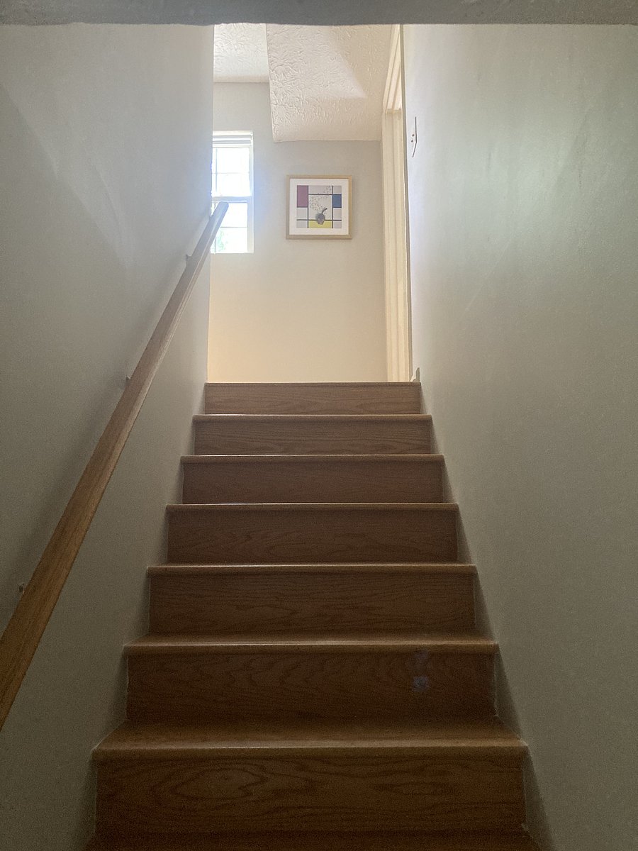 upstairs to bedrooms and full bathroom with laundry.