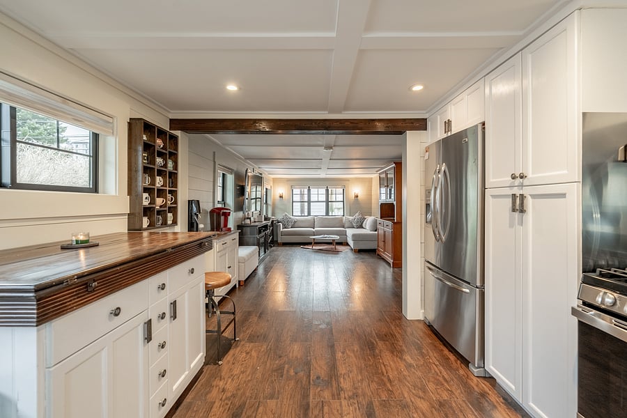 Open-concept kitchen and living area gives this compact cottage a surprisingly spacious feel.