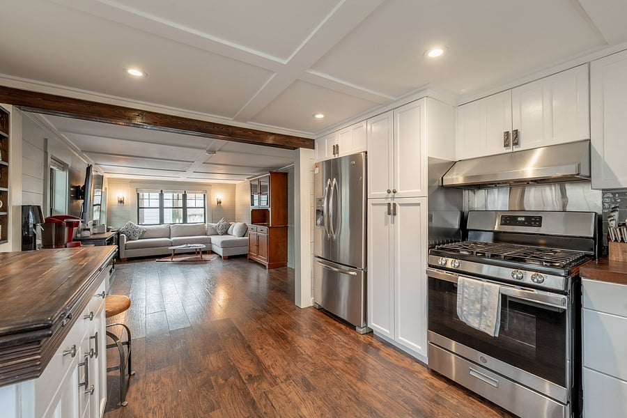 Fully equipped kitchen with stainless steel appliances, generous cabinetry and plenty of workspace.