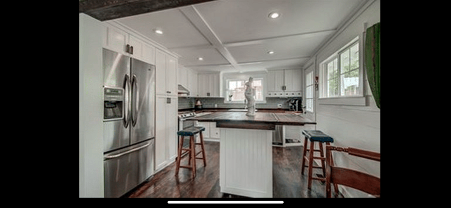 Flexible rolling kitchen island expands for dining, entertaining or extra prep space, then tucks neatly away.