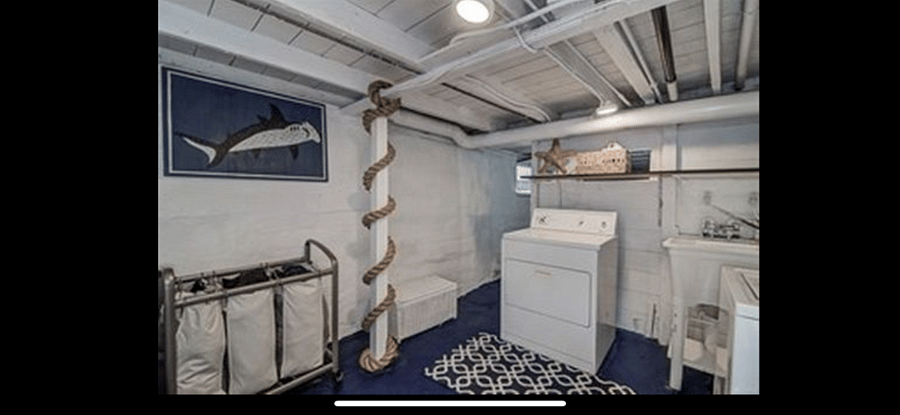 Private on-site washer and dryer are located in the exterior-access basement, with additional storage potentially available by arrangement.