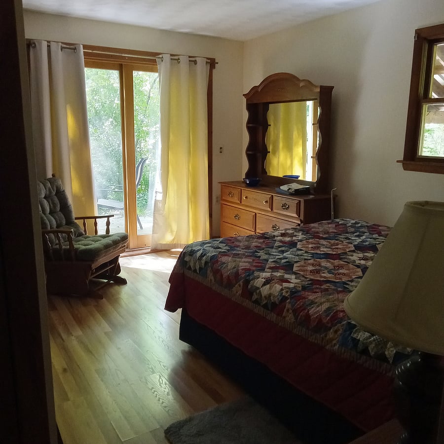 Master bedroom, patio deck porch, queen bed, double closet.