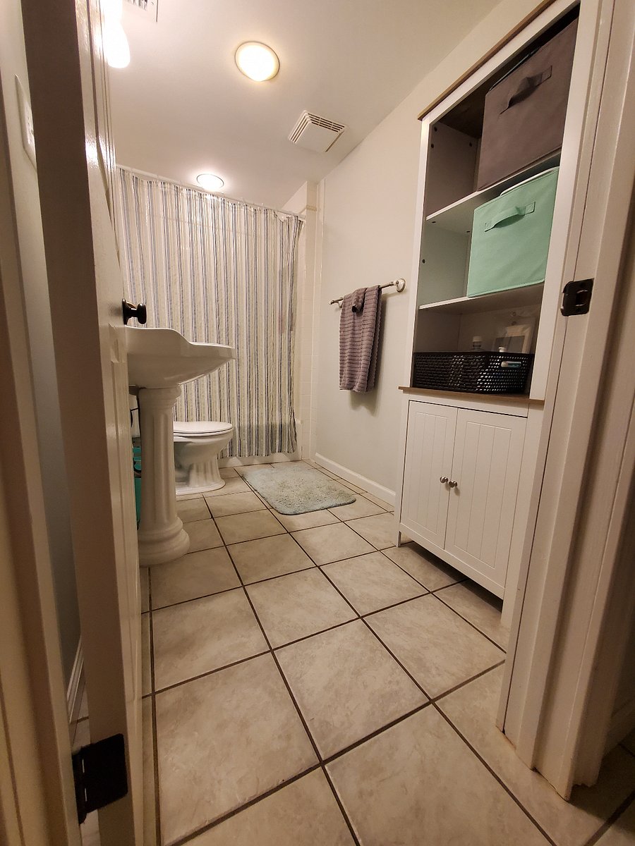 Private bath down shared hall space. Large wall cabinet for personal storage. Linens, towels provided.