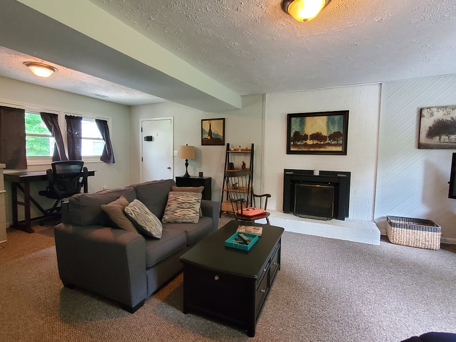View of private entry and main sitting area in studio.